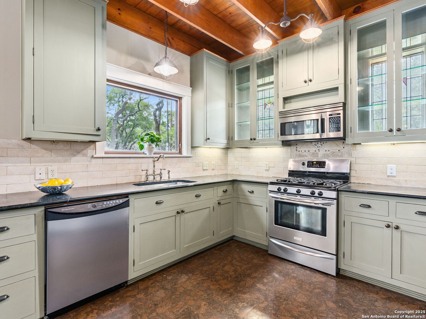 146-144 Ranger Creek Road Boerne, TX 78006 - Photo 38 of 50 a kitchen with stainless steel appliances granite countertop a stove and a sink