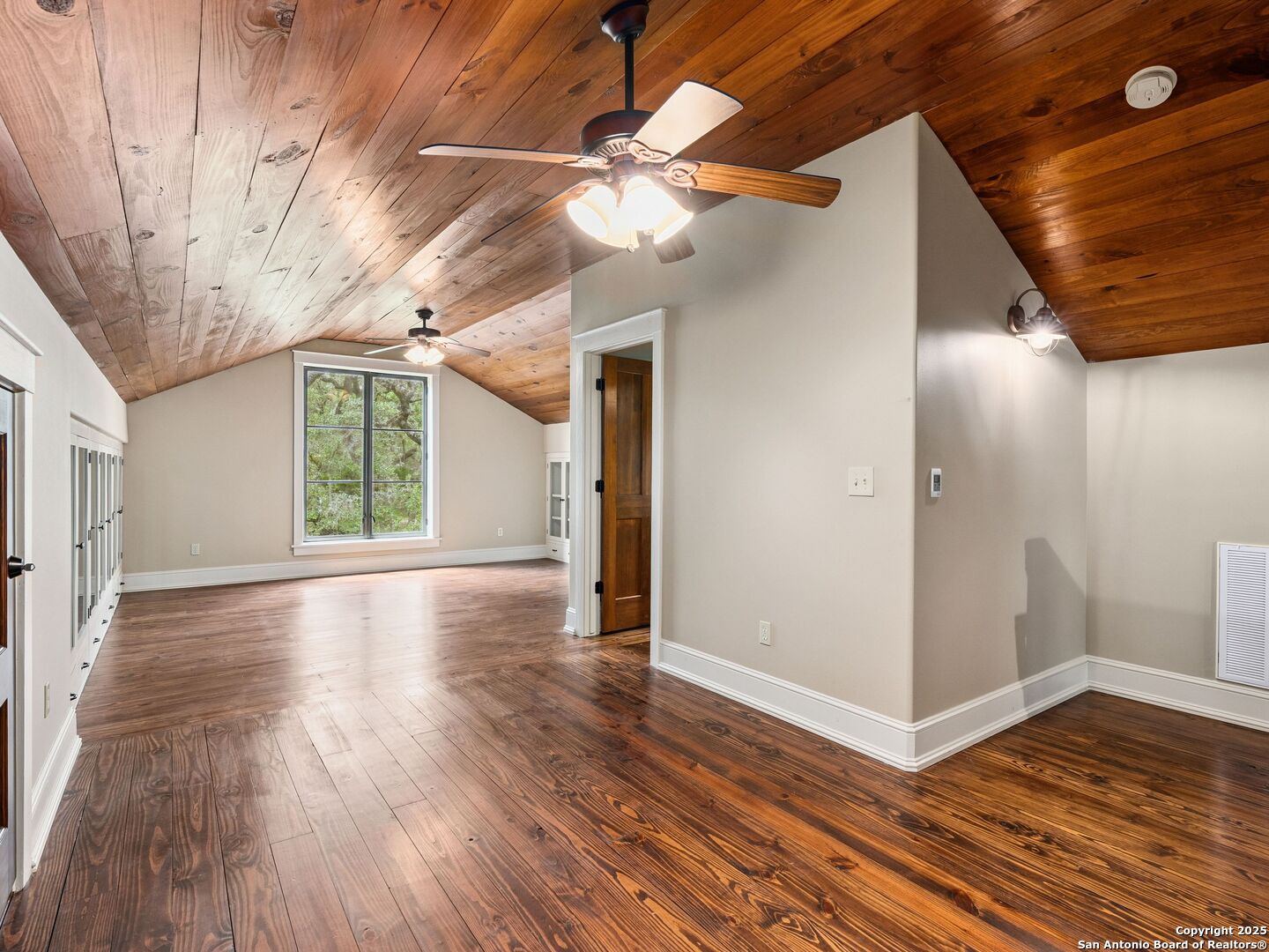 146-144 Ranger Creek Road Boerne, TX 78006 - Photo 45 of 50 a view of a livingroom with wooden floor and a ceiling fan