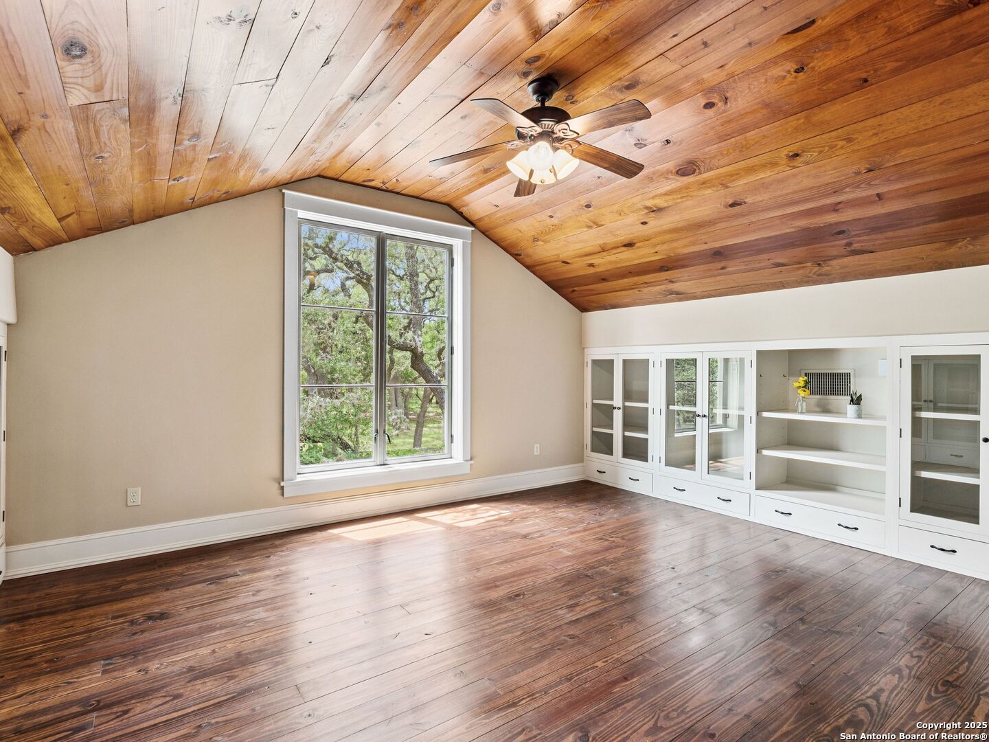146-144 Ranger Creek Road Boerne, TX 78006 - Photo 46 of 50 an empty room with wooden floor fan and windows