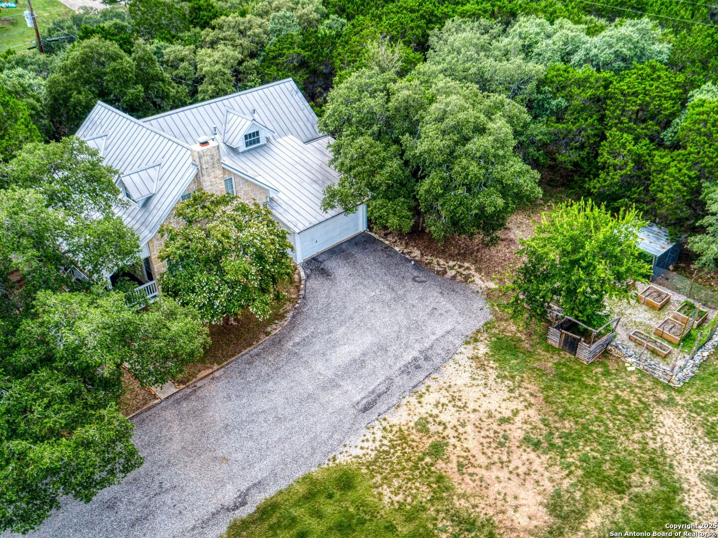 146-144 Ranger Creek Road Boerne, TX 78006 - Photo 48 of 50 an aerial view of a house with a yard and trees all around