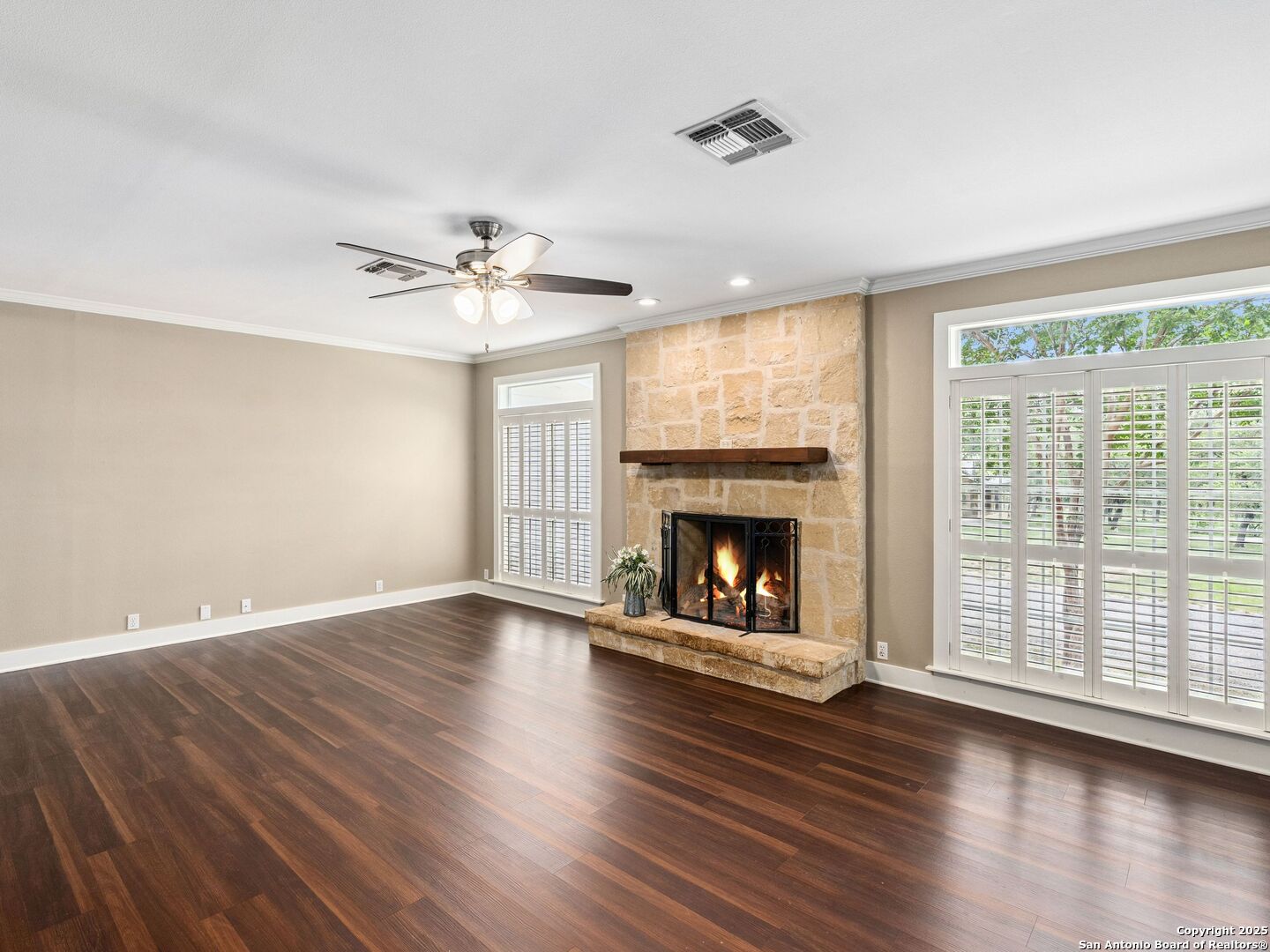 146-144 Ranger Creek Road Boerne, TX 78006 - Photo 5 of 50 an empty room with wooden floor a fireplace and windows