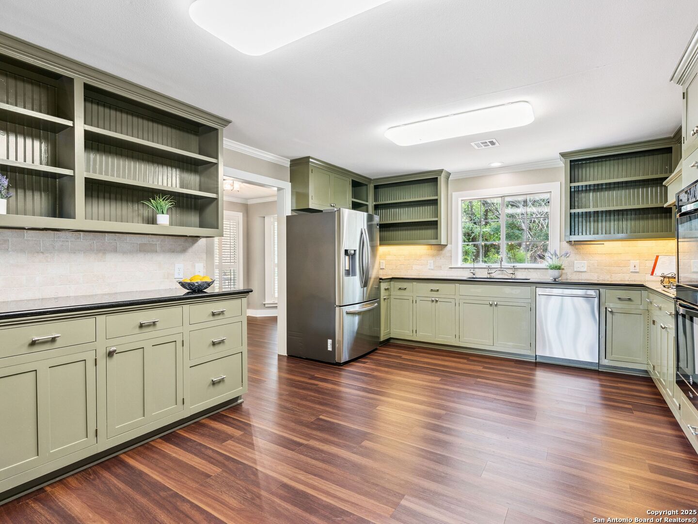 146-144 Ranger Creek Road Boerne, TX 78006 - Photo 9 of 50 a kitchen with stainless steel appliances a refrigerator sink and cabinets