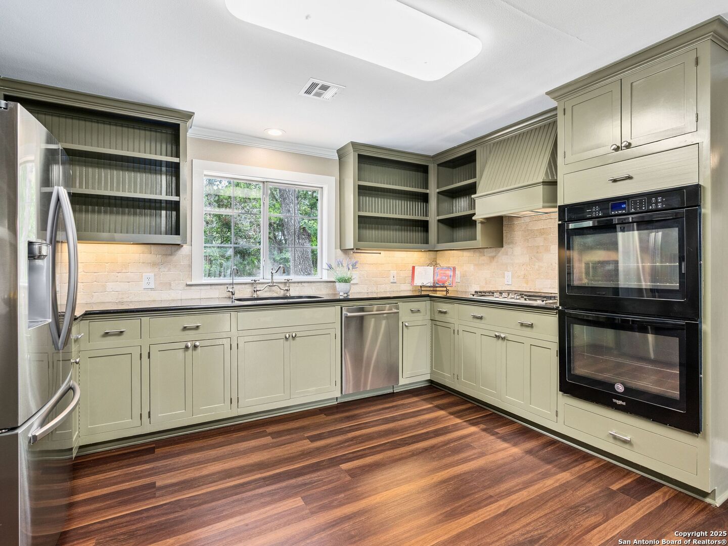 146-144 Ranger Creek Road Boerne, TX 78006 - Photo 10 of 50 a kitchen with granite countertop a stove a sink and a microwave