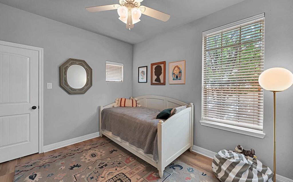 550 Hunton Lane Robinson, TX 76706 - Photo 27 of 35 Bedroom featuring wood finished floors and ceiling fan