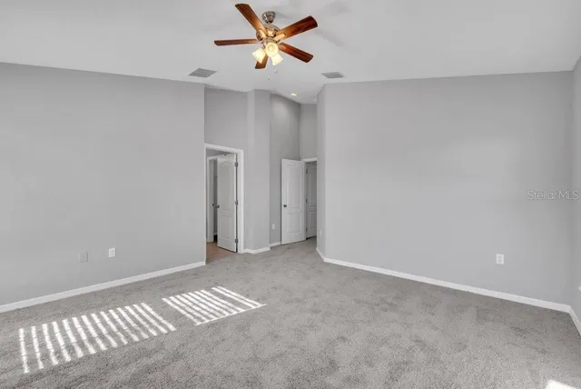 a view of an empty room and window