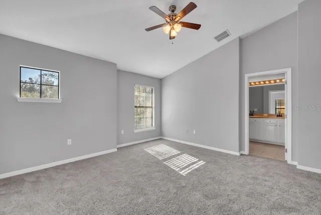 a view of livingroom with a ceiling fan and window