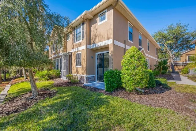 a view of a building with a yard