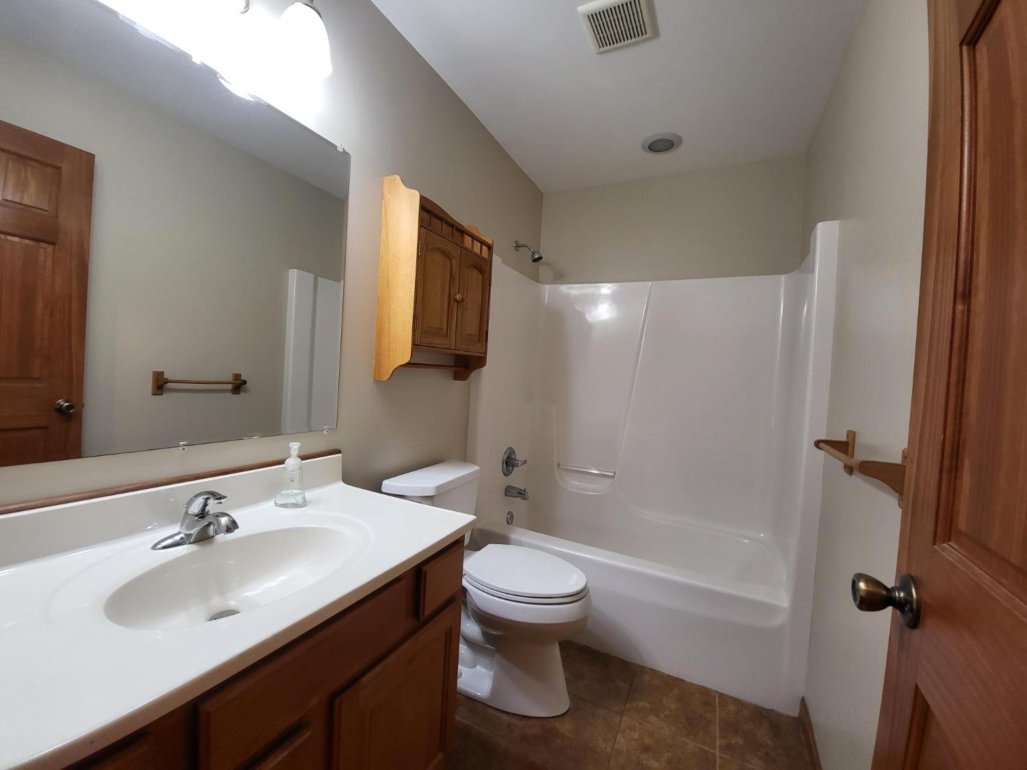 412 Juniper Street Northwest De Motte, IN 46310 - Photo 18 of 23 a bathroom with a sink toilet tub and shower