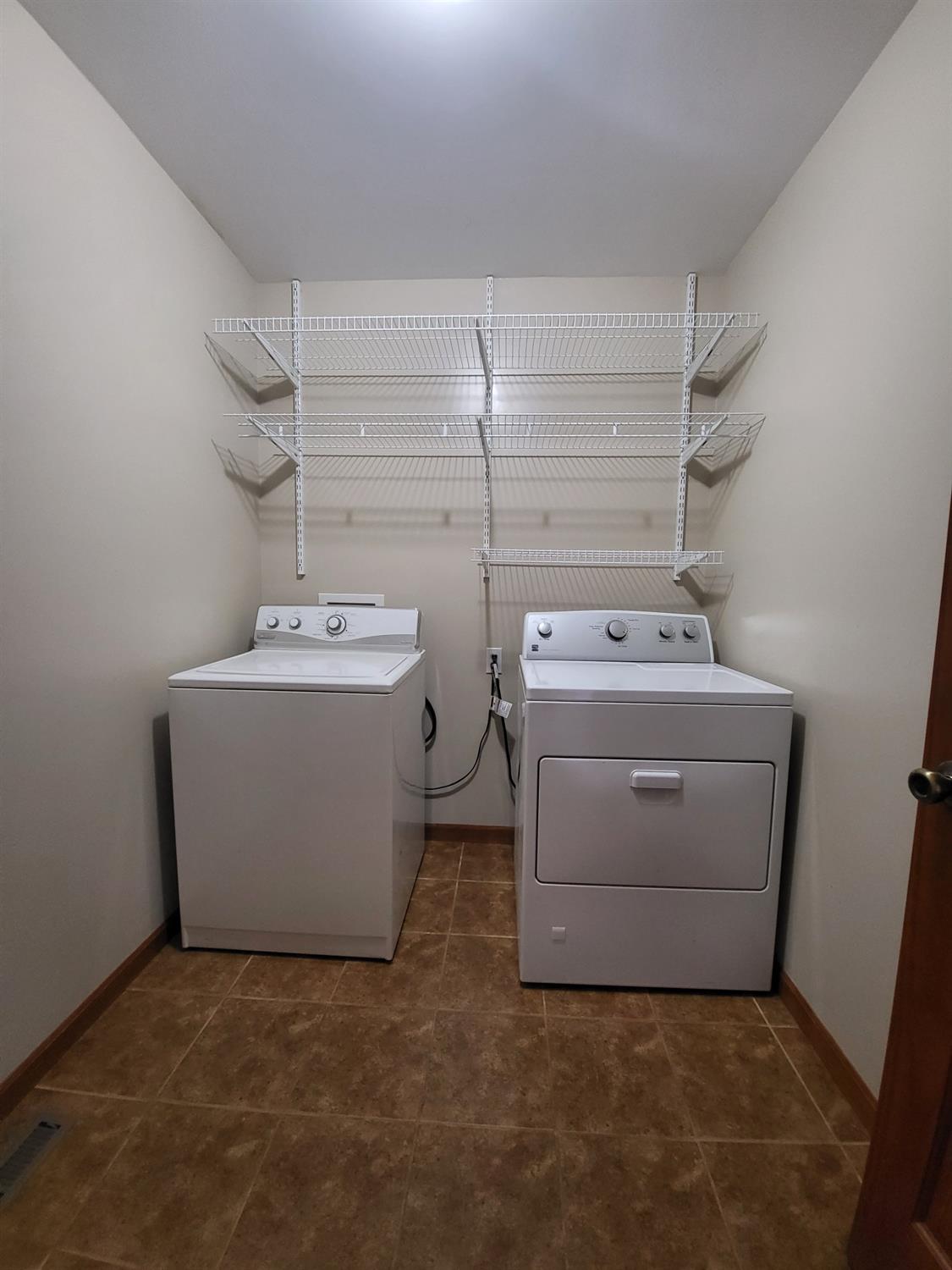 412 Juniper Street Northwest De Motte, IN 46310 - Photo 23 of 23 a utility room with dryer and washer