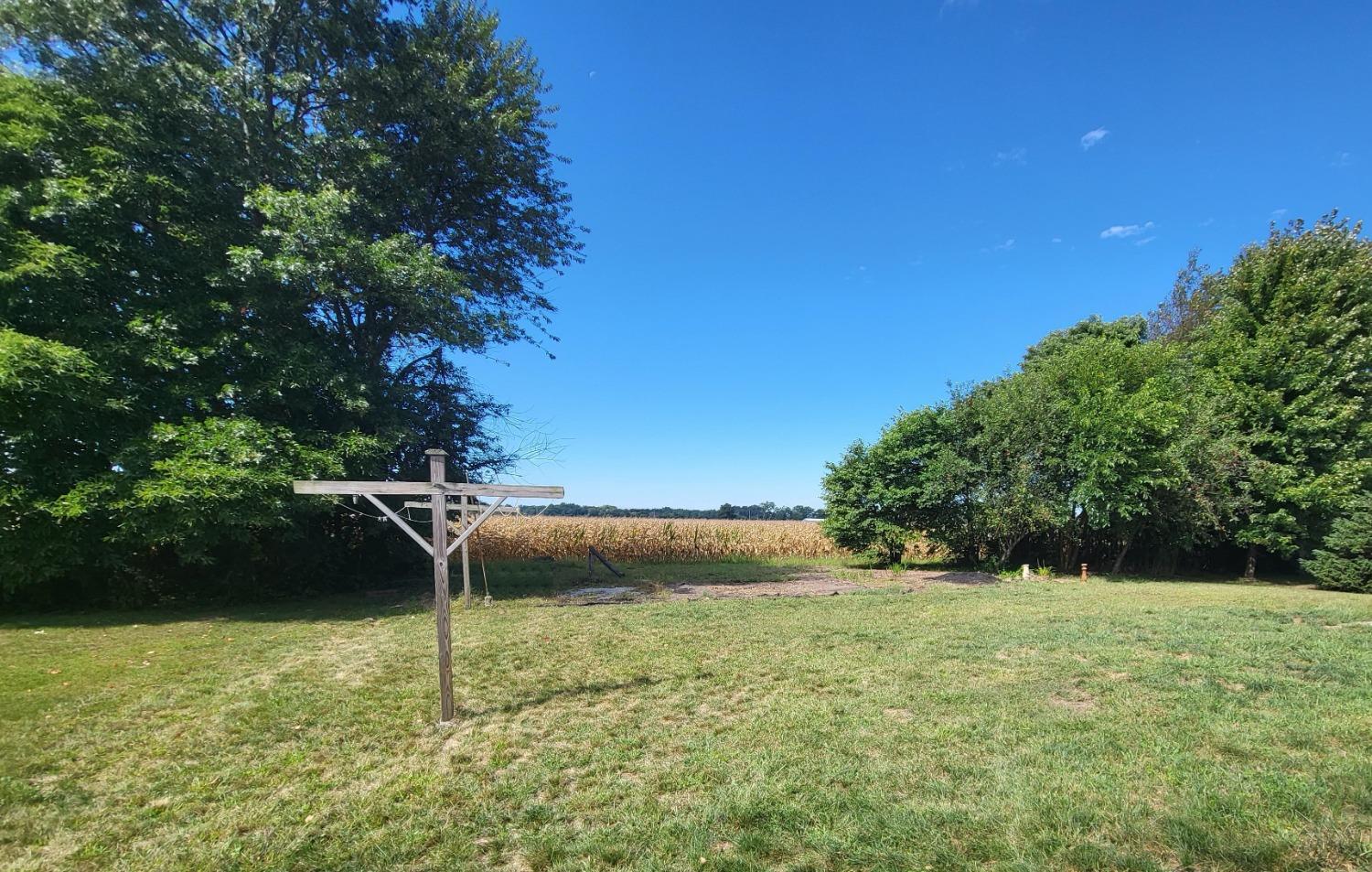 412 Juniper Street Northwest De Motte, IN 46310 - Photo 3 of 23 a backyard of a house with lots of green space