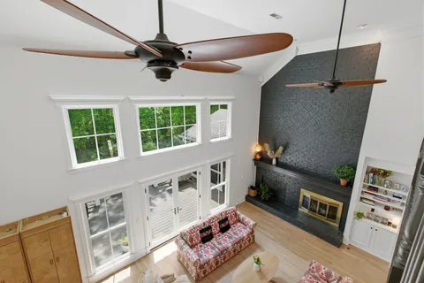 a house view with swimming pool in front of it