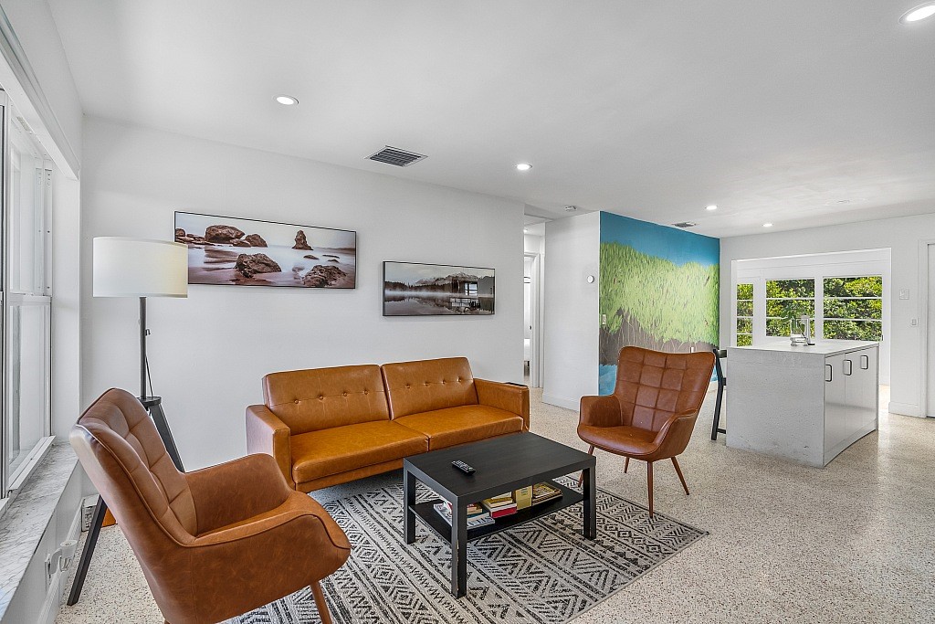 a living room with furniture and a window