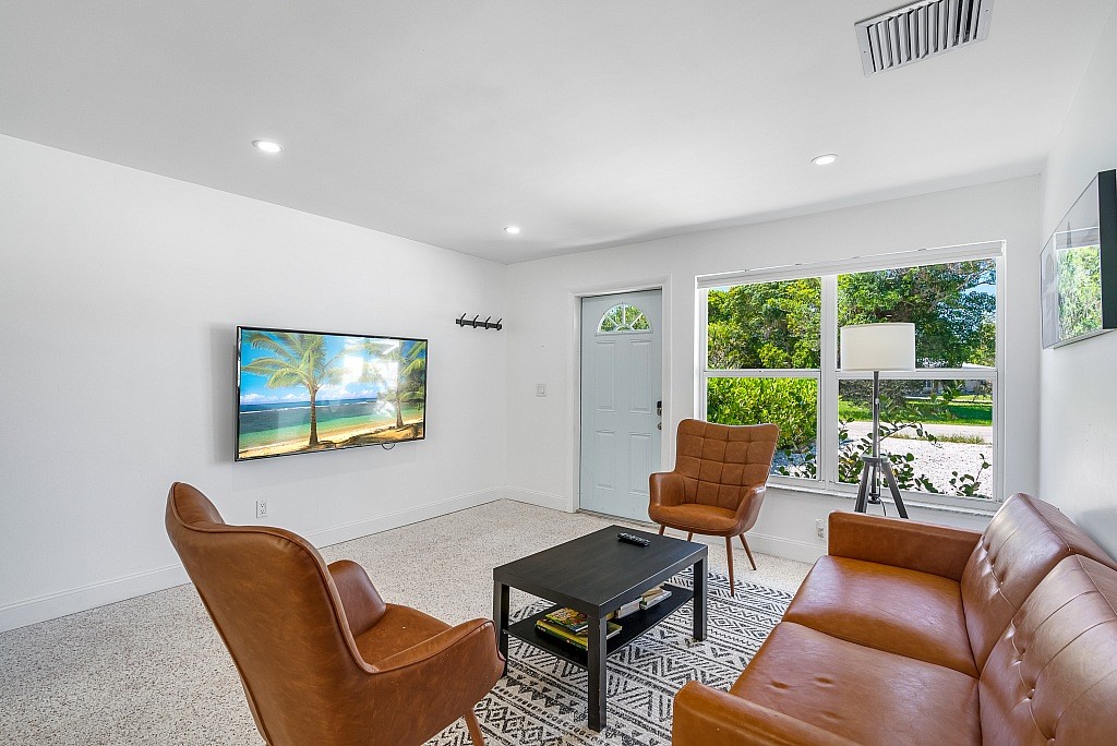 30 Southwest Hideaway Place Stuart, FL 34994 - Photo 6 of 35 a living room with furniture and a window