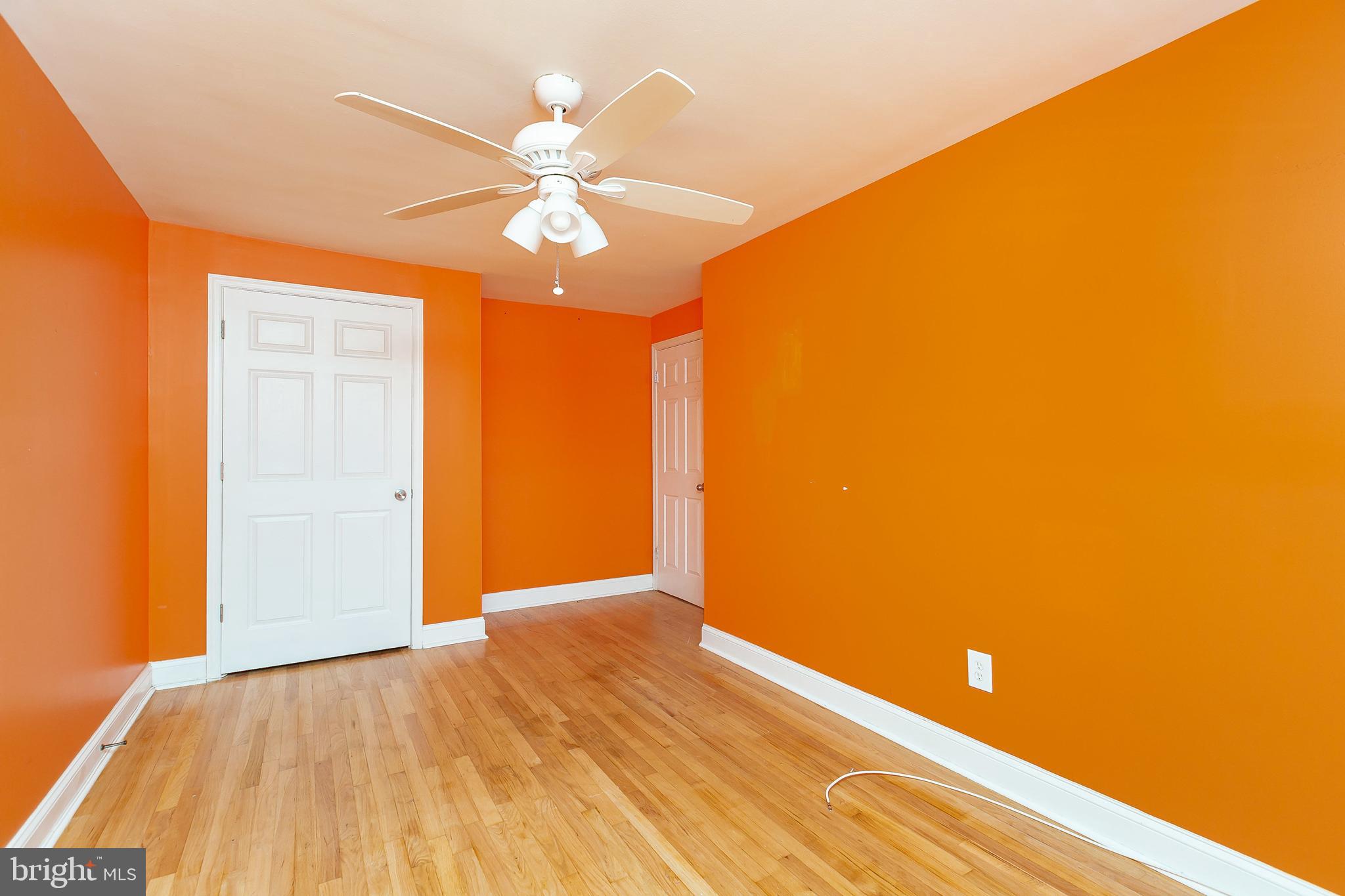 4921 St Gemma Road Baltimore, MD 21229 - Photo 19 of 33 a view of a livingroom with a hall and wooden floor