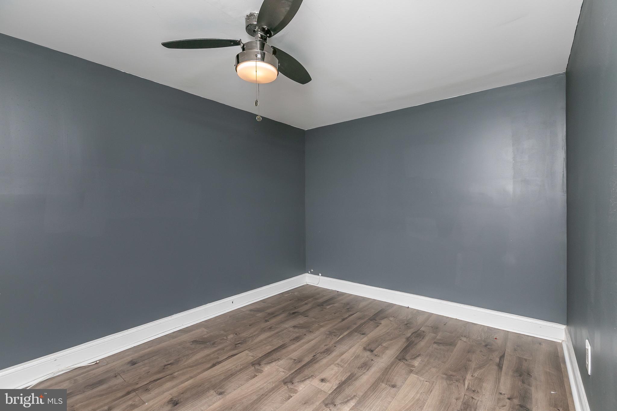 4921 St Gemma Road Baltimore, MD 21229 - Photo 23 of 33 a view of empty room with wooden floor