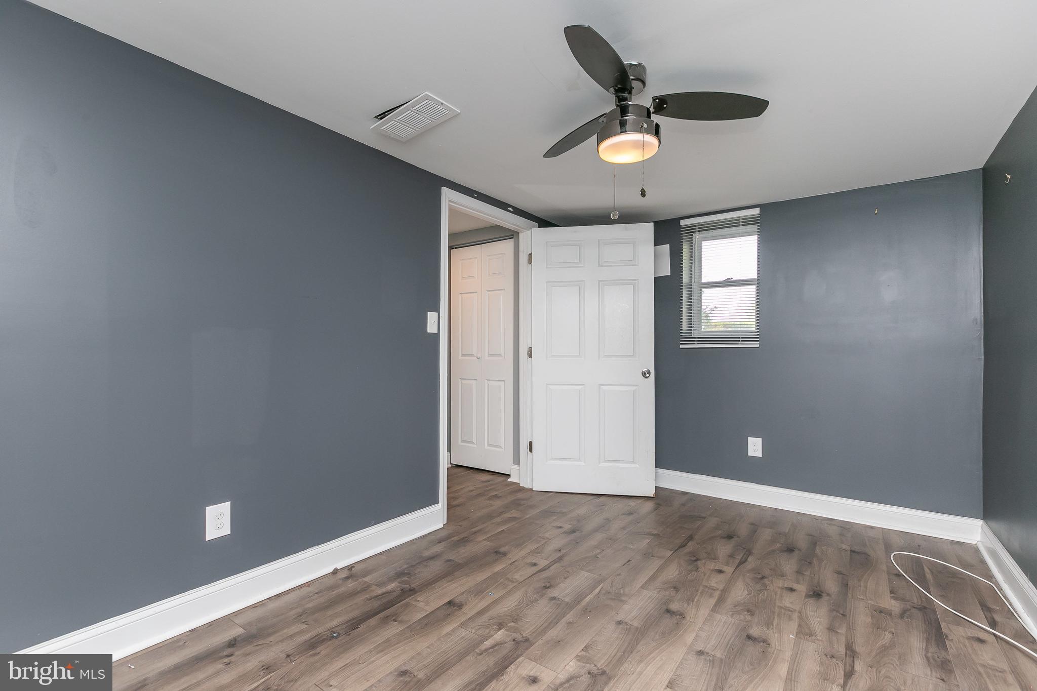 4921 St Gemma Road Baltimore, MD 21229 - Photo 24 of 33 wooden floor in an empty room with a window