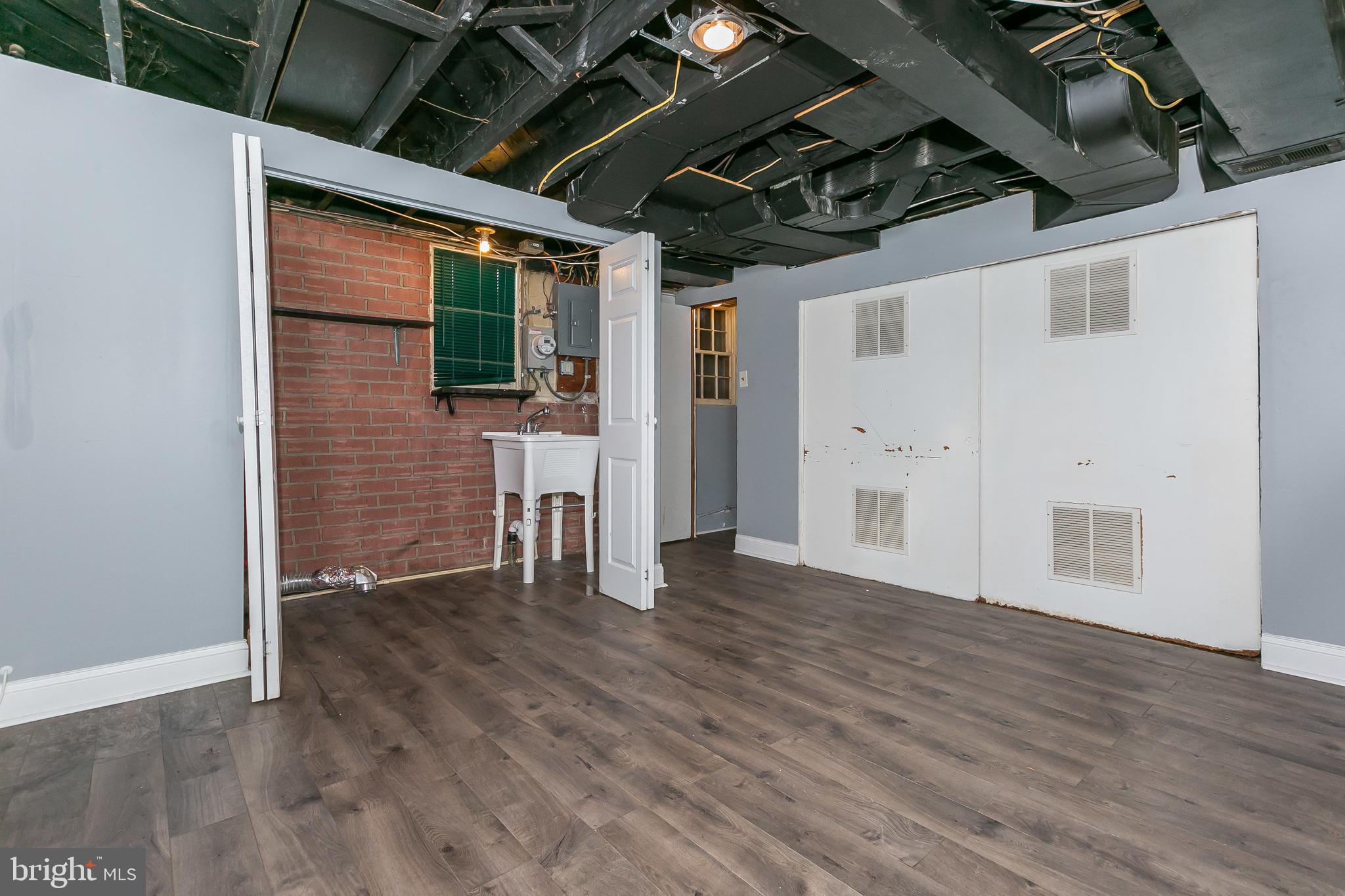 4921 St Gemma Road Baltimore, MD 21229 - Photo 26 of 33 a view of empty room with wooden floor