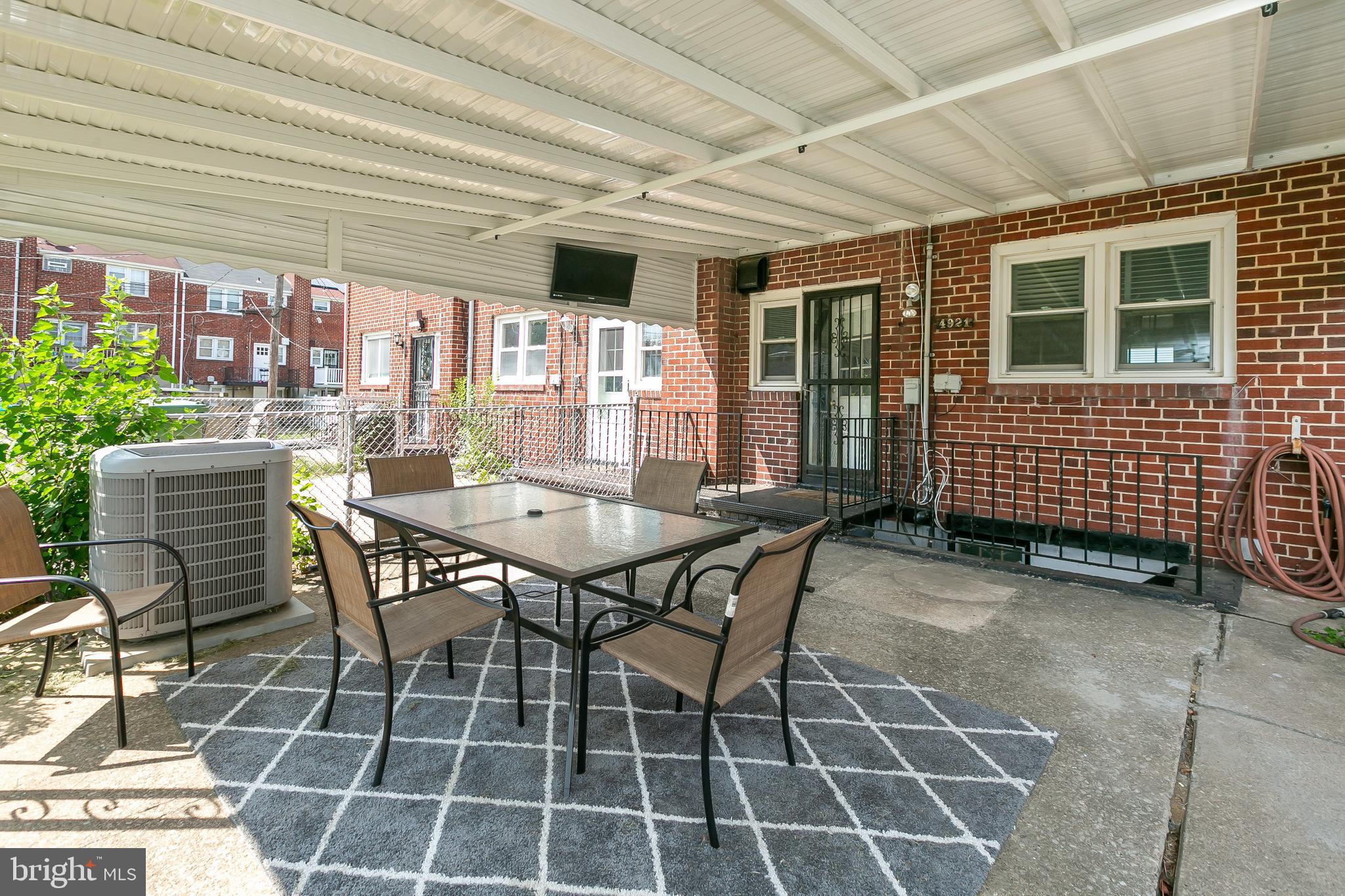 4921 St Gemma Road Baltimore, MD 21229 - Photo 30 of 33 a dining room with furniture and outdoor space