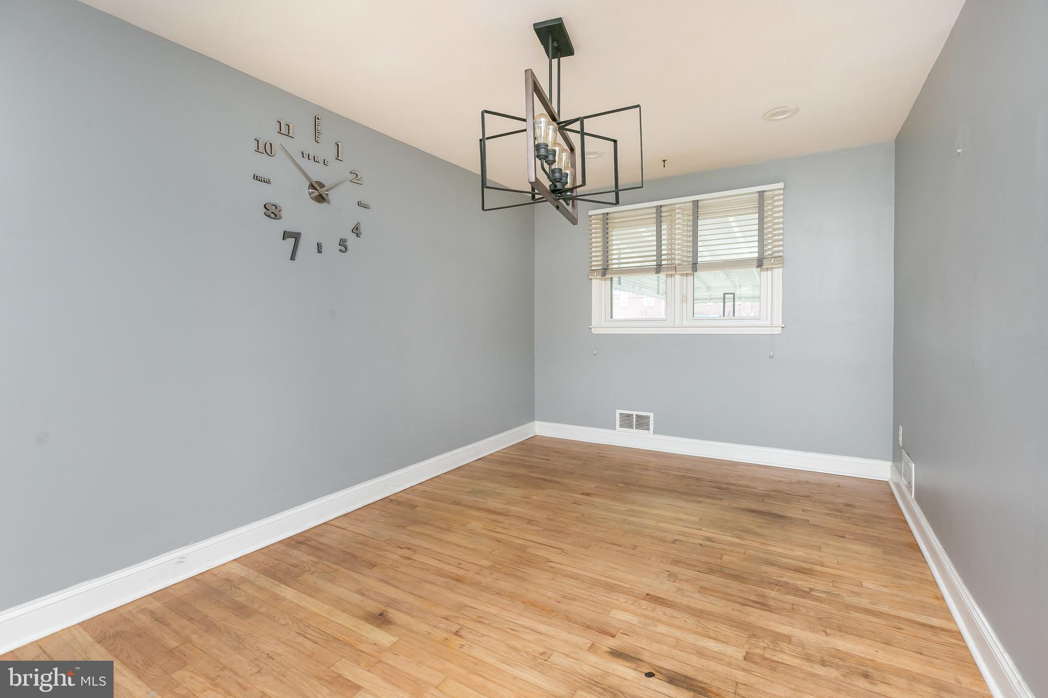 4921 St Gemma Road Baltimore, MD 21229 - Photo 8 of 33 wooden floor in an empty room with a window
