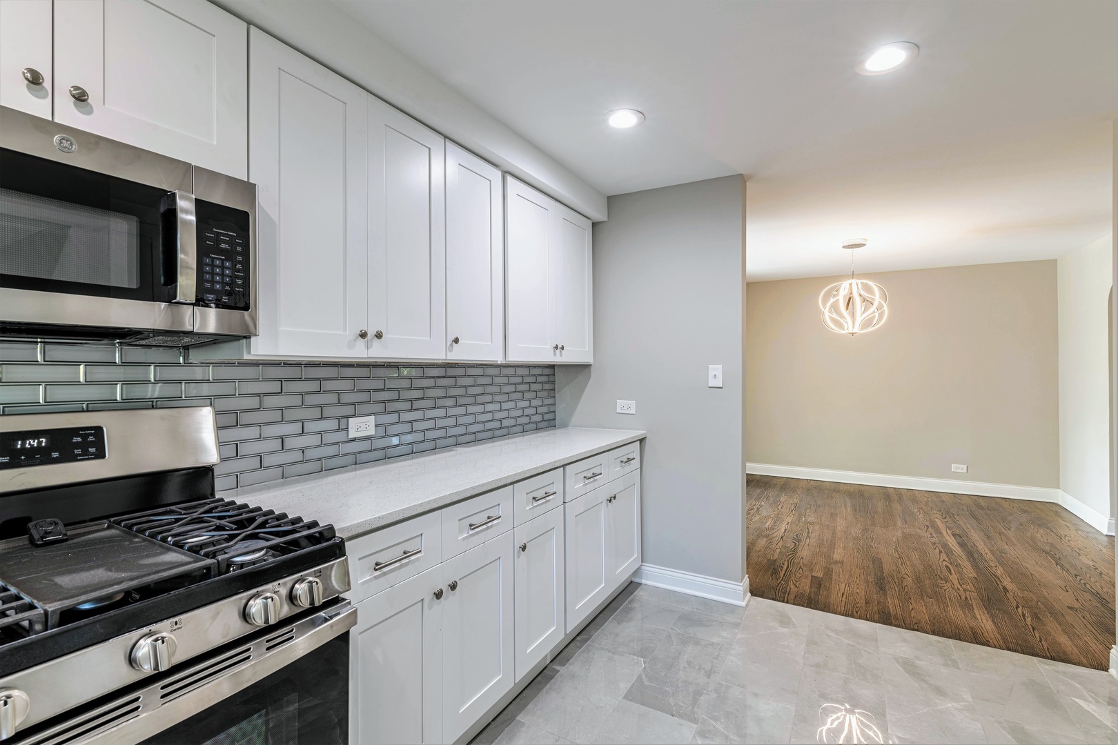 2845 Birch Road Homewood, IL 60430 - Photo 10 of 36 a kitchen with stainless steel appliances granite countertop a stove and a microwave