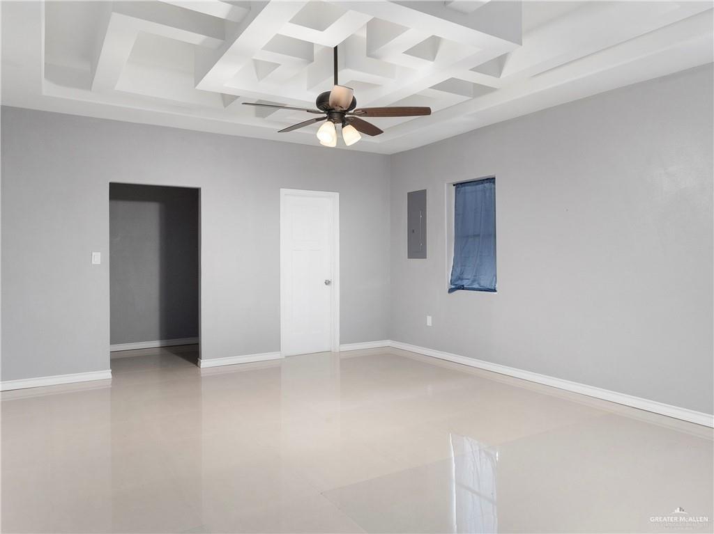 504 Benito Street Rio Grande City, TX 78582 - Photo 12 of 26 en empty room with ceiling fan and window