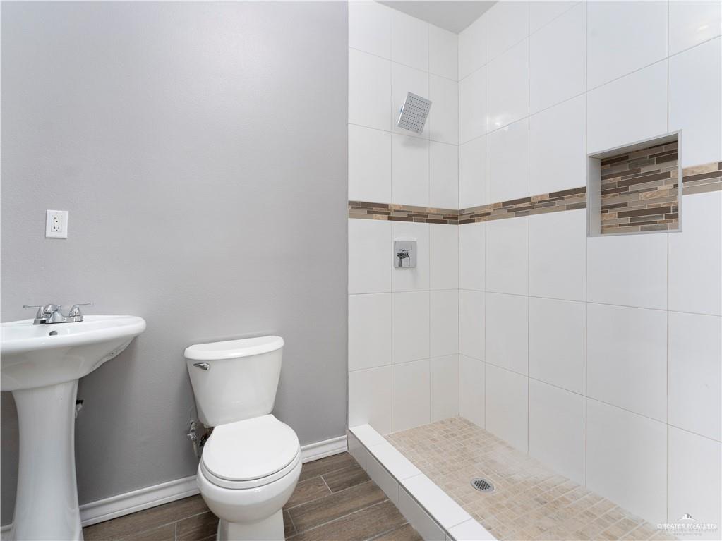 504 Benito Street Rio Grande City, TX 78582 - Photo 15 of 26 a bathroom with a sink toilet and shower