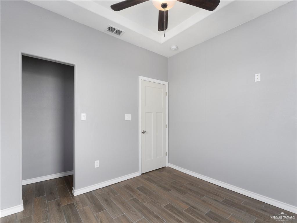 504 Benito Street Rio Grande City, TX 78582 - Photo 21 of 26 a view of an empty room with wooden floor