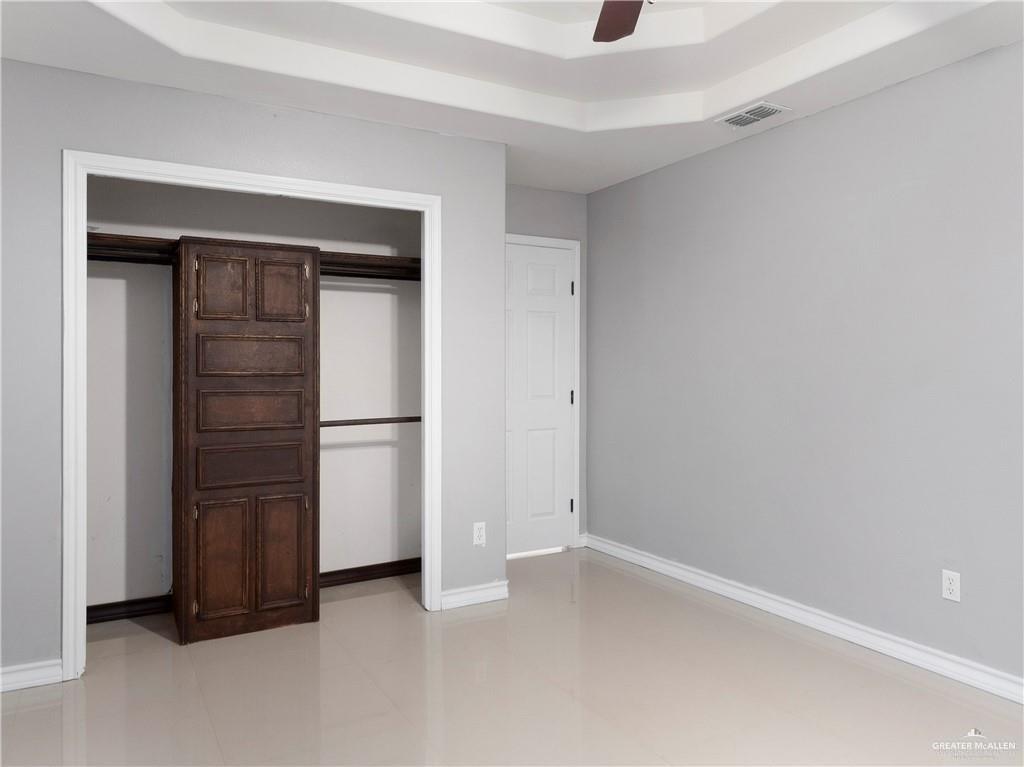 504 Benito Street Rio Grande City, TX 78582 - Photo 8 of 26 a view of an empty room with closet and cabinet