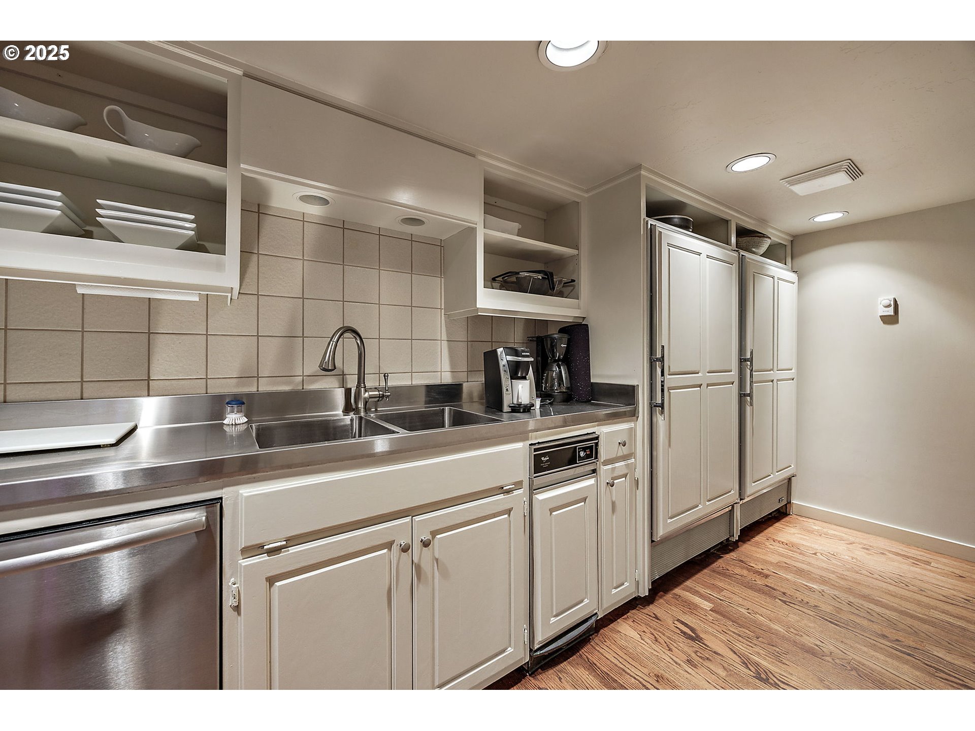 1630 Northwest Olmar Drive Grants Pass, OR 97526 - Photo 15 of 42 a kitchen with stainless steel appliances white cabinets and a sink