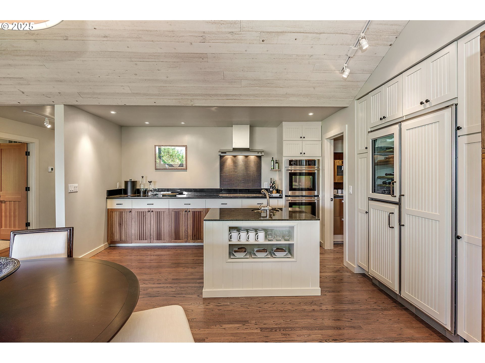 1630 Northwest Olmar Drive Grants Pass, OR 97526 - Photo 16 of 42 a kitchen with stainless steel appliances kitchen island granite countertop a refrigerator a stove and a sink