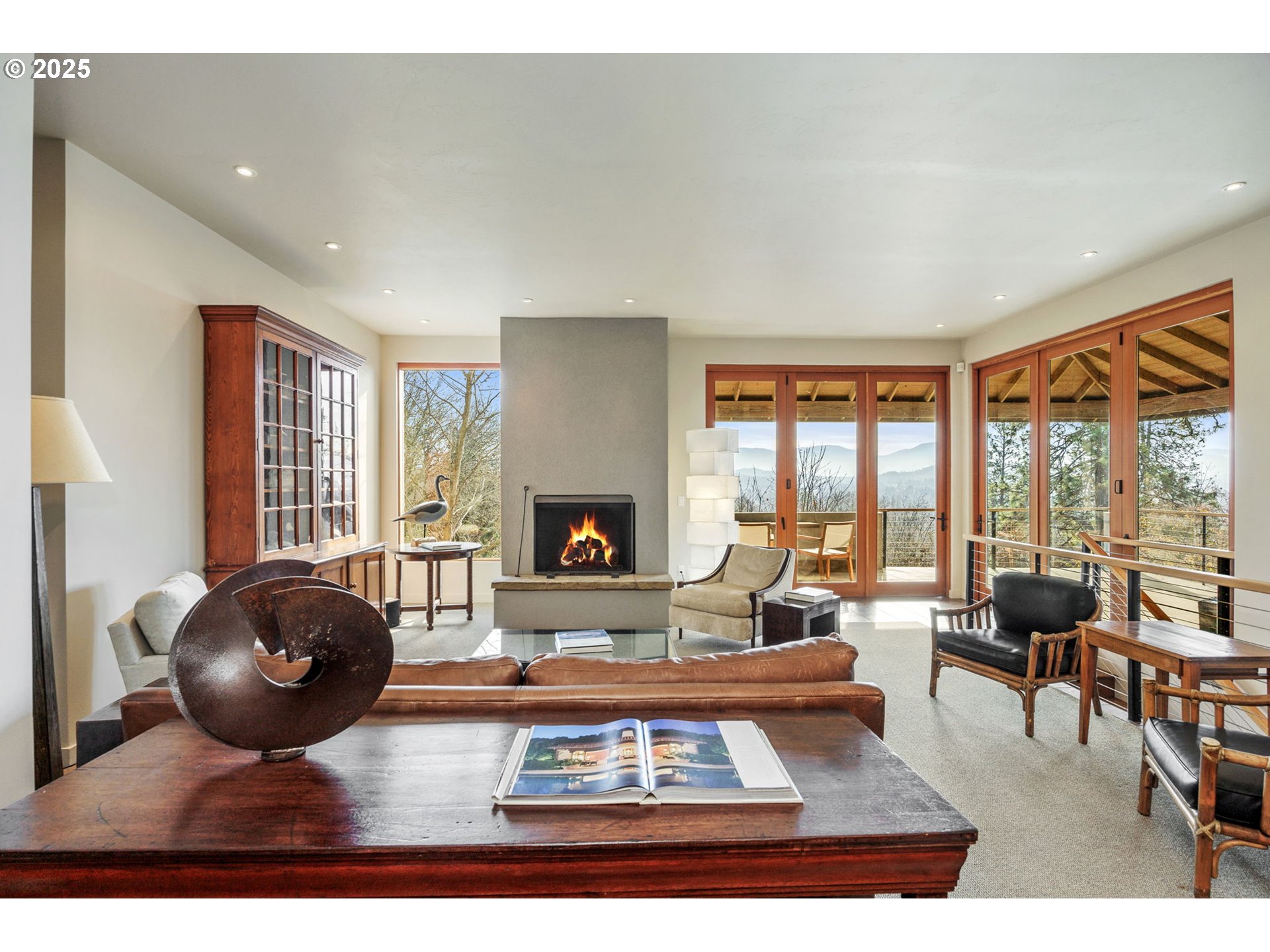 1630 Northwest Olmar Drive Grants Pass, OR 97526 - Photo 7 of 42 a living room with furniture a fireplace and large windows