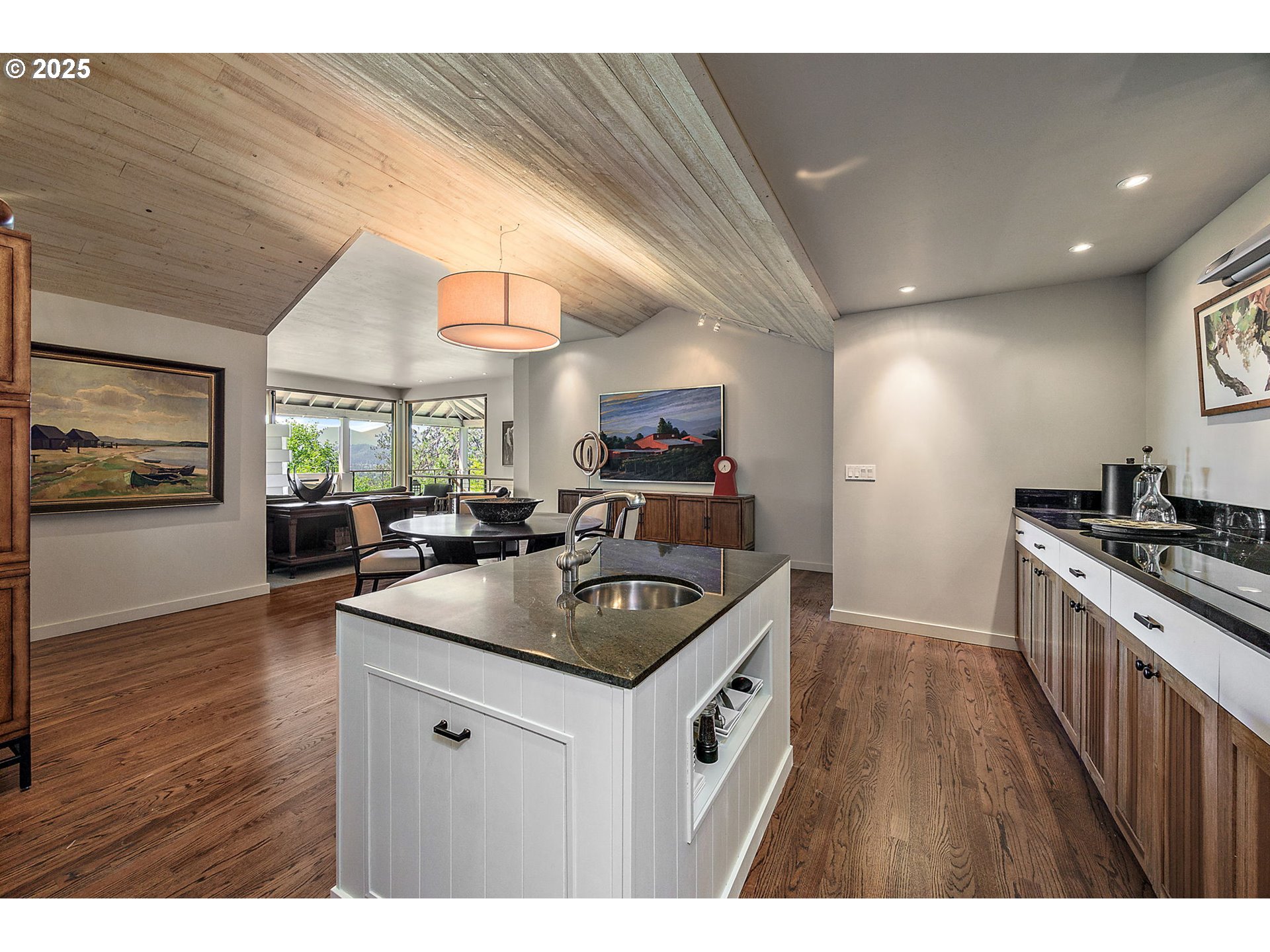 1630 Northwest Olmar Drive Grants Pass, OR 97526 - Photo 10 of 42 a kitchen with stainless steel appliances granite countertop a sink a stove and a wooden floors