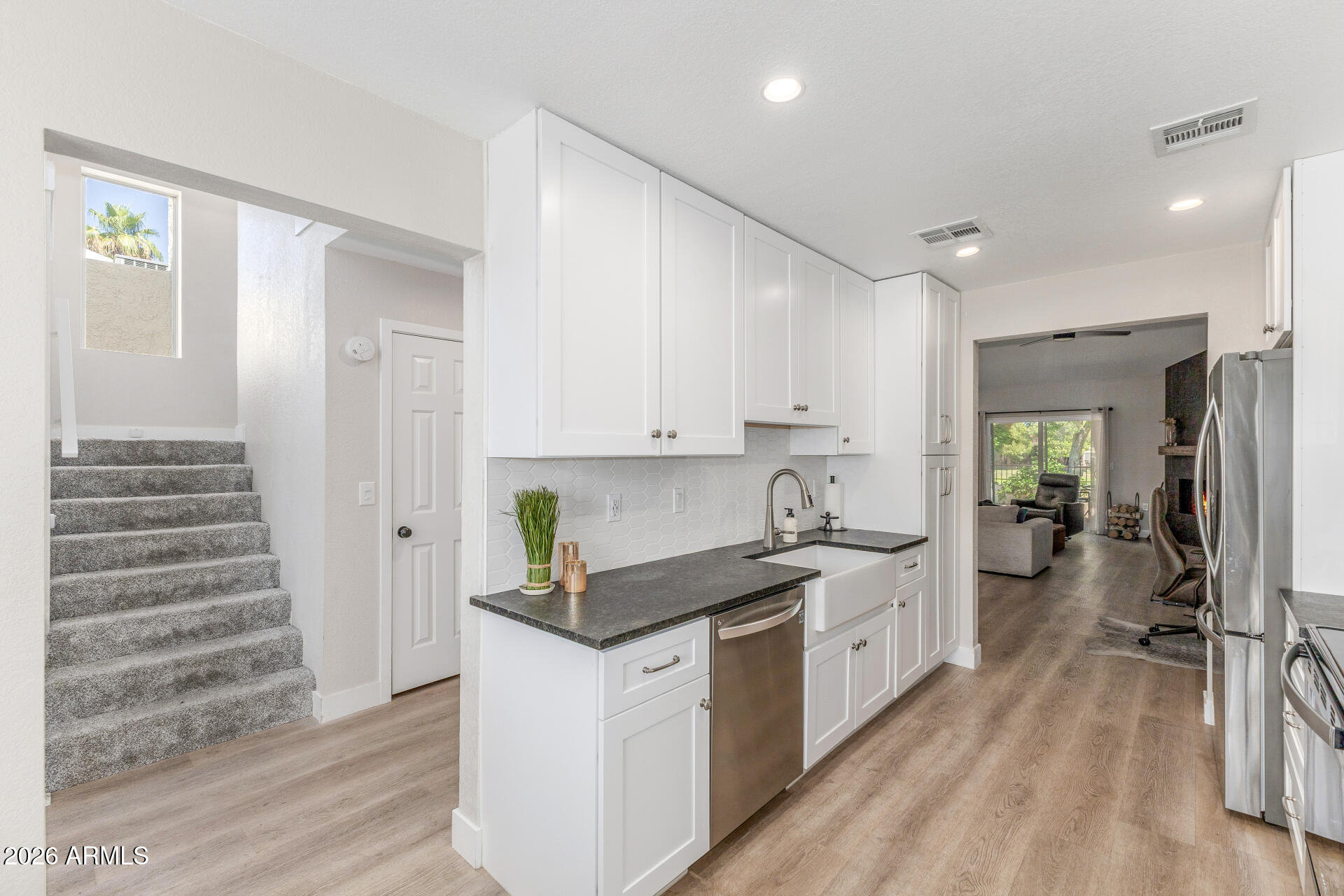 11629 North 40th Way Phoenix, AZ 85028 - Photo 13 of 47 a kitchen with a sink stove and cabinets