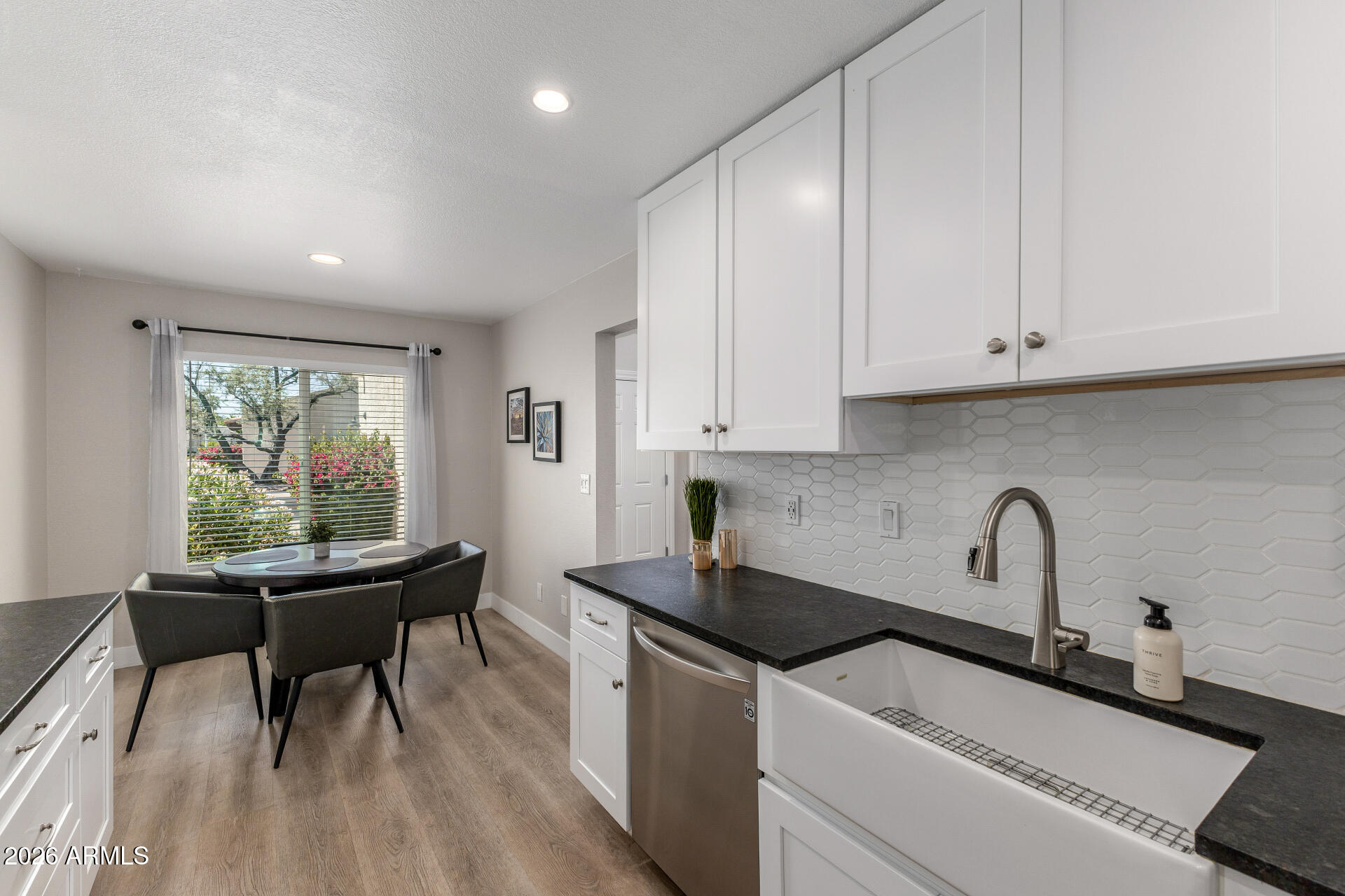 11629 North 40th Way Phoenix, AZ 85028 - Photo 15 of 47 a kitchen with a sink and cabinets