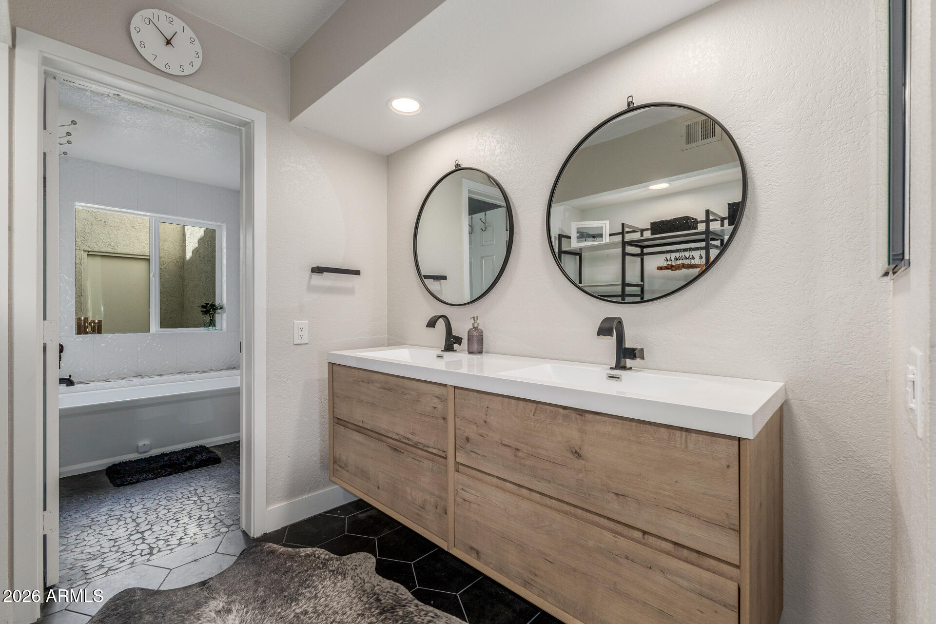 11629 North 40th Way Phoenix, AZ 85028 - Photo 22 of 47 a bathroom with a sink and a mirror