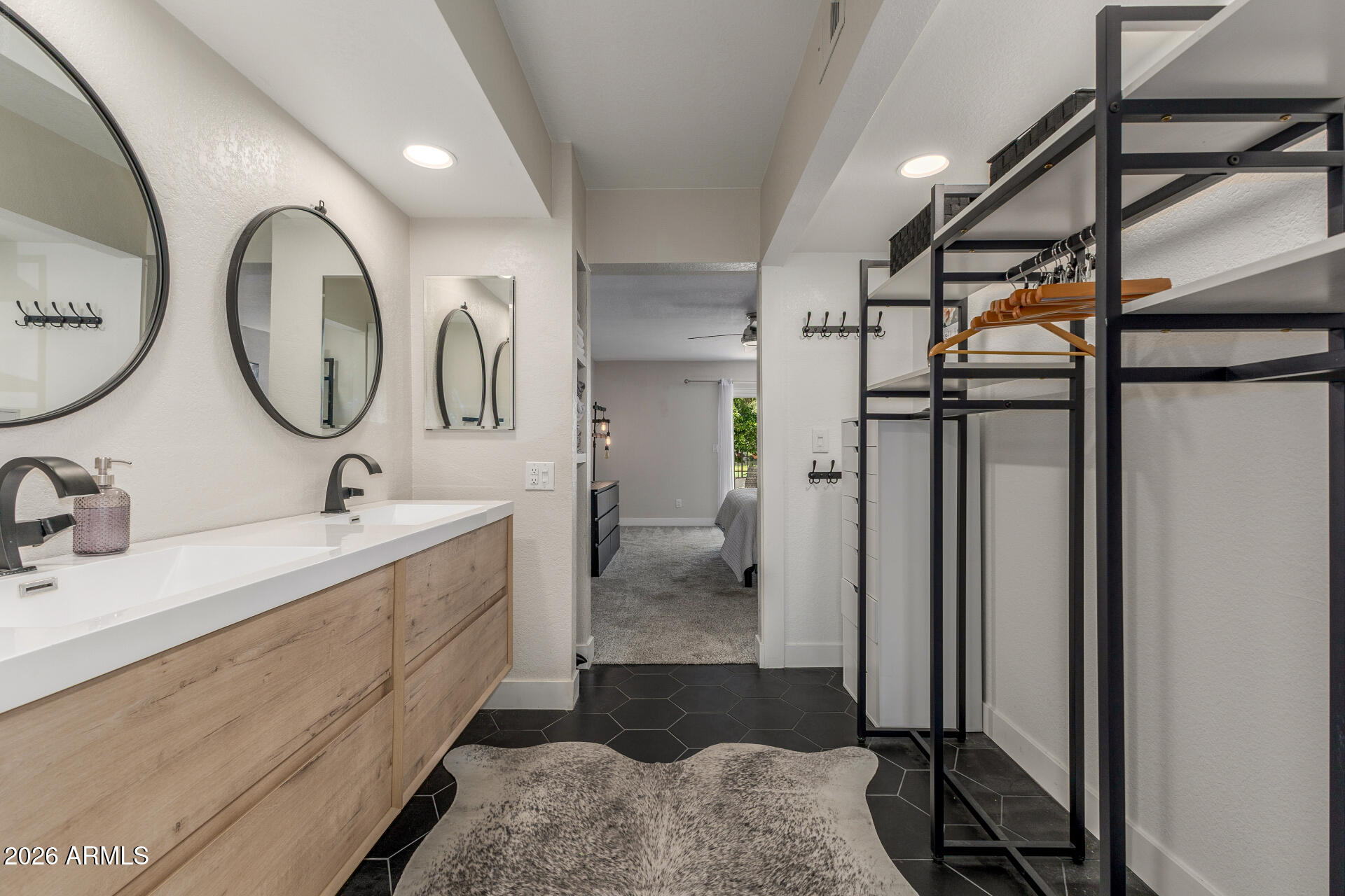 11629 North 40th Way Phoenix, AZ 85028 - Photo 23 of 47 a bathroom with a double vanity sink and a mirror