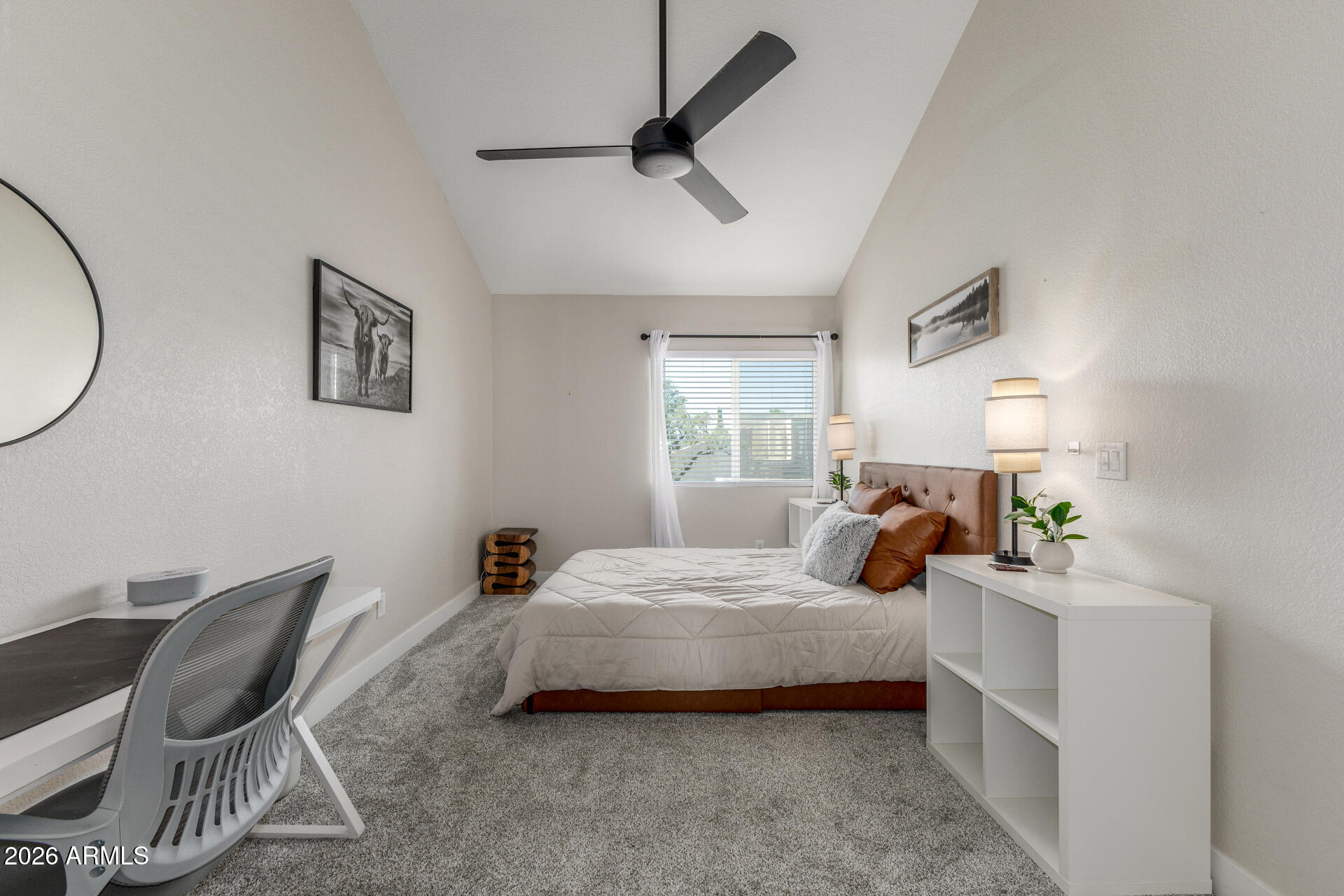 11629 North 40th Way Phoenix, AZ 85028 - Photo 27 of 47 a bedroom with a bed and chair