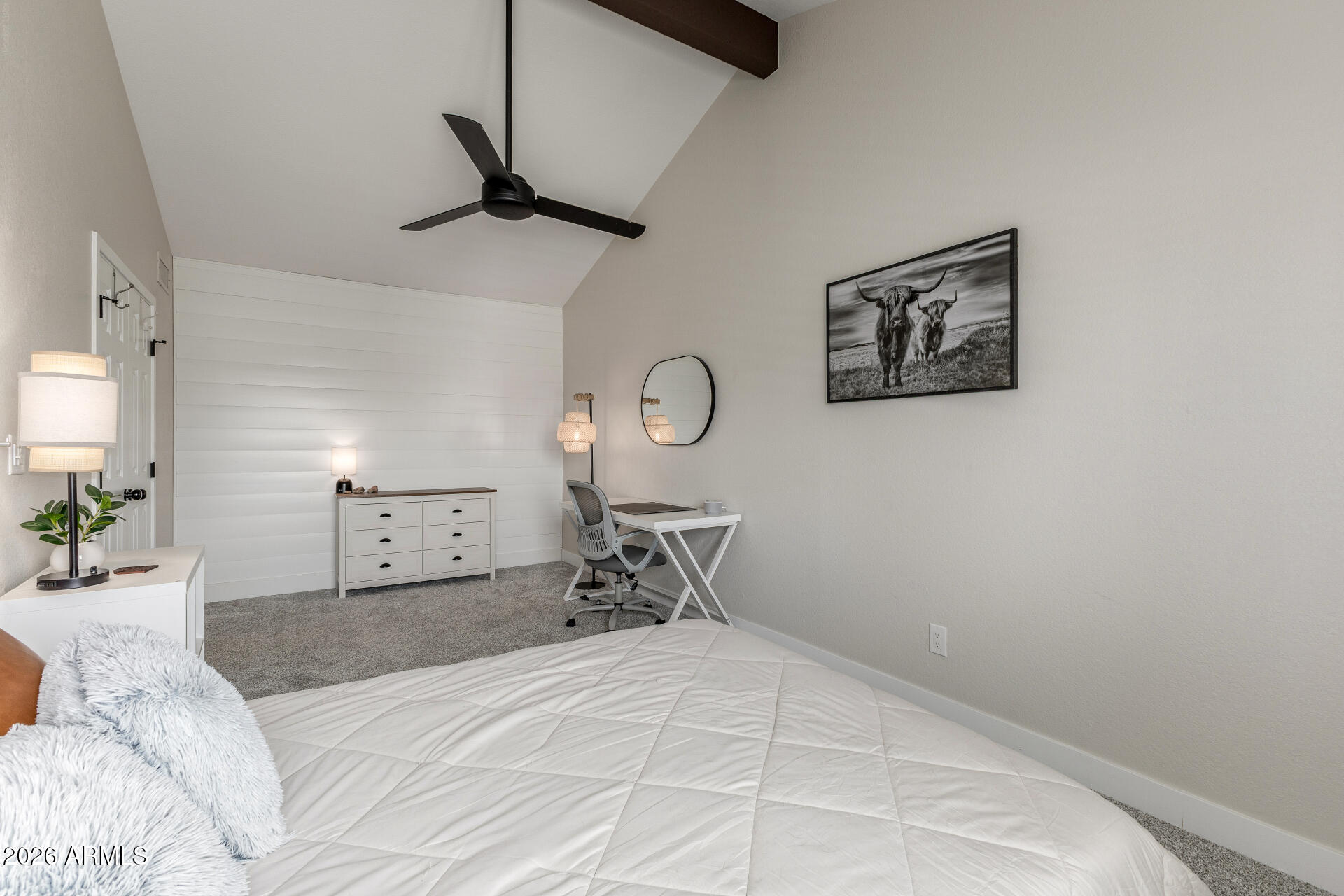 11629 North 40th Way Phoenix, AZ 85028 - Photo 28 of 47 a bedroom with a bed and a chandelier