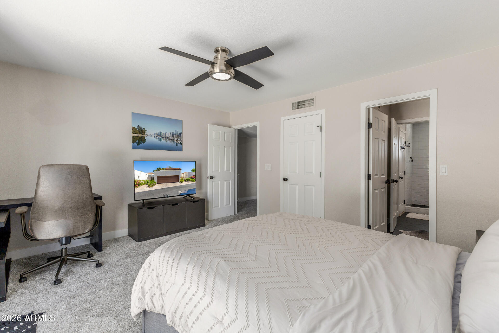 11629 North 40th Way Phoenix, AZ 85028 - Photo 31 of 47 a bedroom with a bed a desk and chair