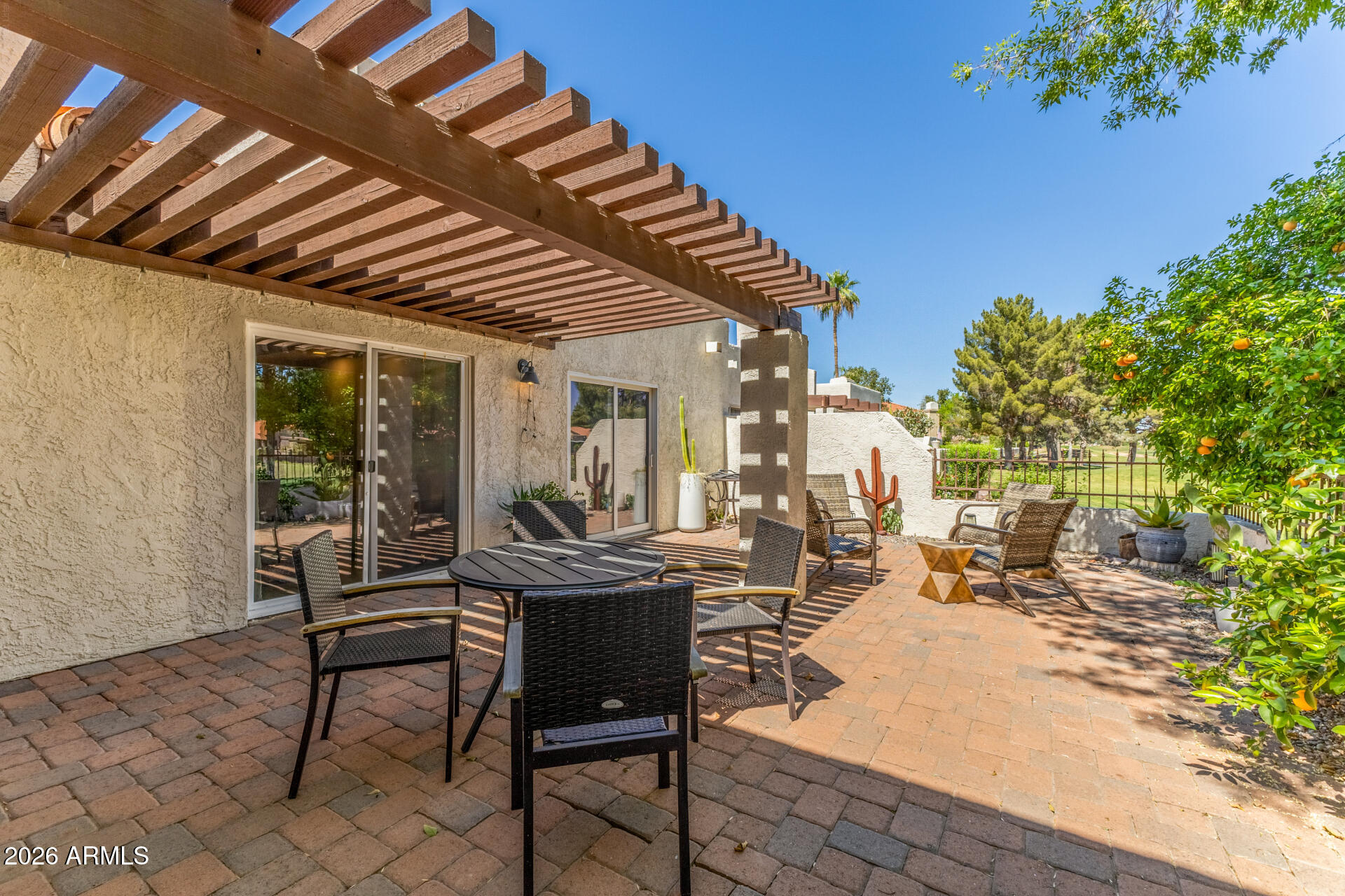 11629 North 40th Way Phoenix, AZ 85028 - Photo 40 of 47 a view of a patio with table and chairs and potted plants