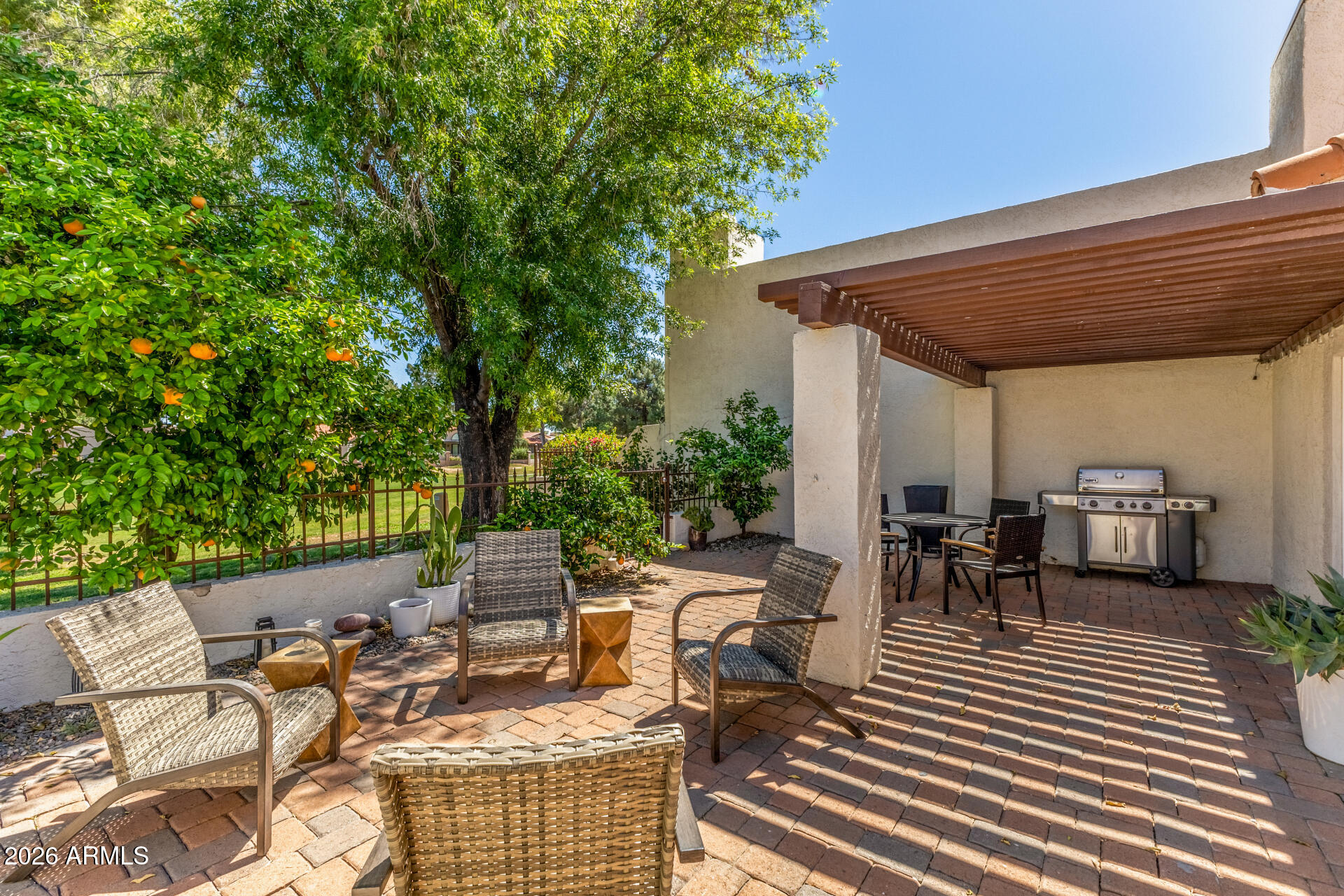 11629 North 40th Way Phoenix, AZ 85028 - Photo 41 of 47 a view of a patio with table and chairs and potted plants