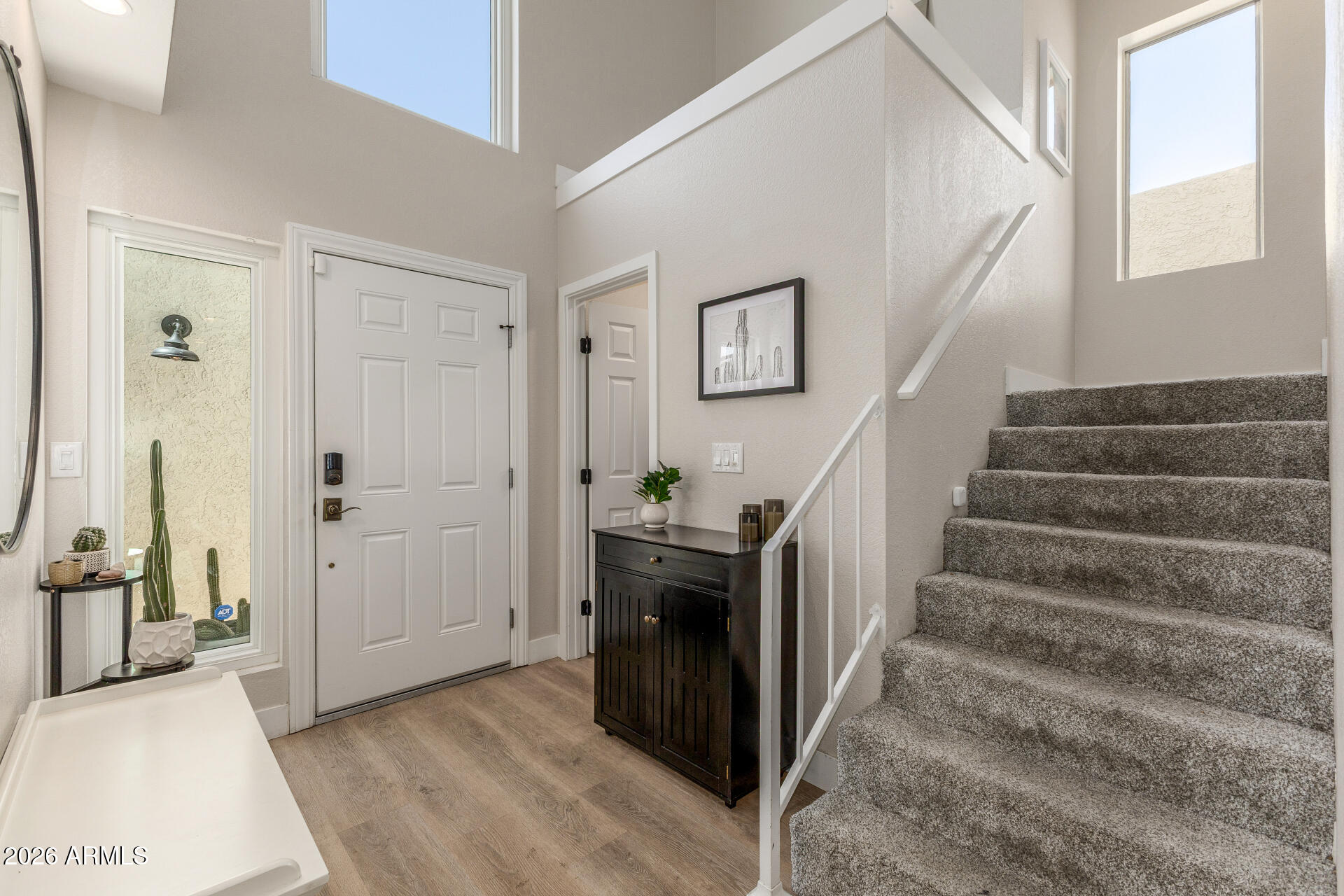 11629 North 40th Way Phoenix, AZ 85028 - Photo 8 of 47 a view of entryway and hall with wooden floor