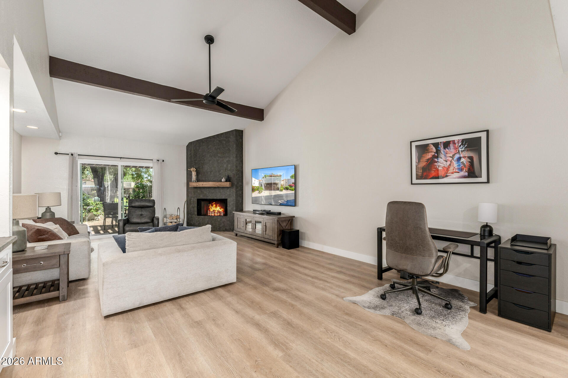 11629 North 40th Way Phoenix, AZ 85028 - Photo 9 of 47 a view of a livingroom with workspace and a couch