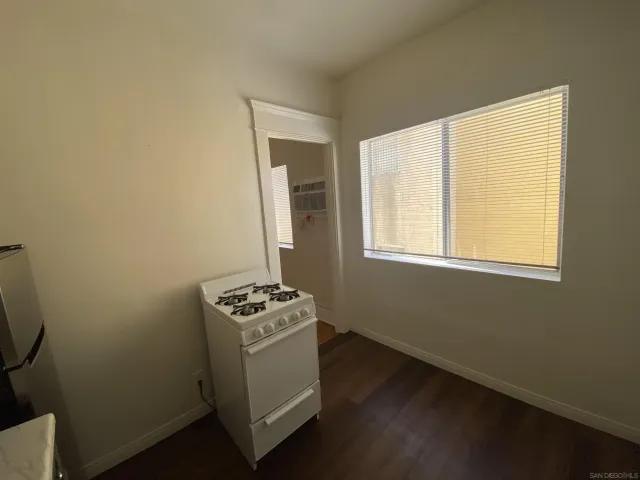a kitchen with a stove and a refrigerator