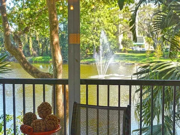 a view of a swimming pool and a yard