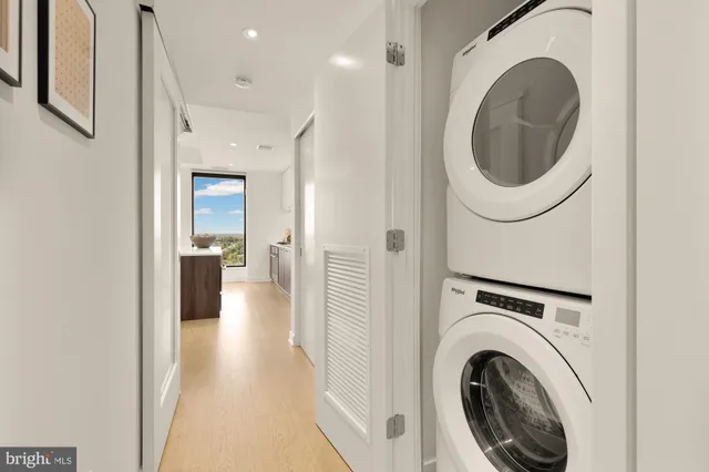 a view of a hallway with washer and dryer