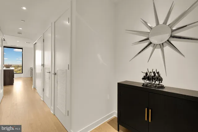 a view of a hallway with a chandelier