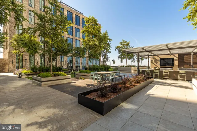 a view of a building with cars park