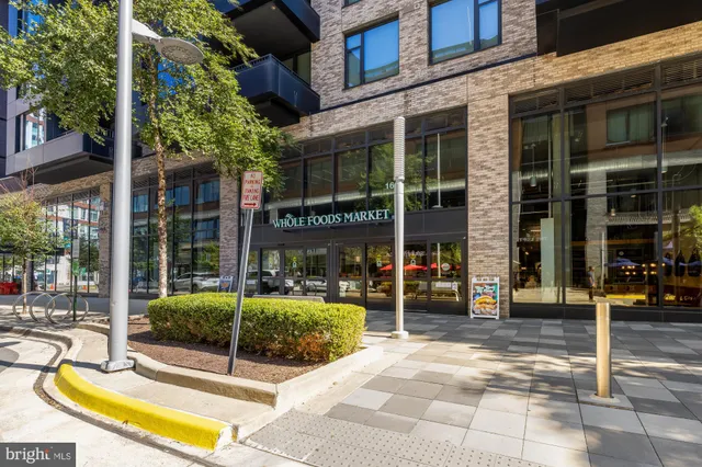 a view of a car parked in front of a building