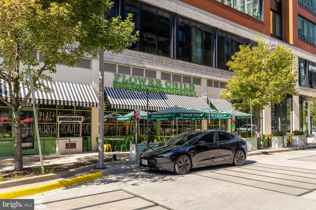 a view of a swimming pool with outdoor seating